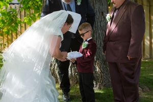 Hidden Gem wedding Meridian Idaho bride taking ring off pillow