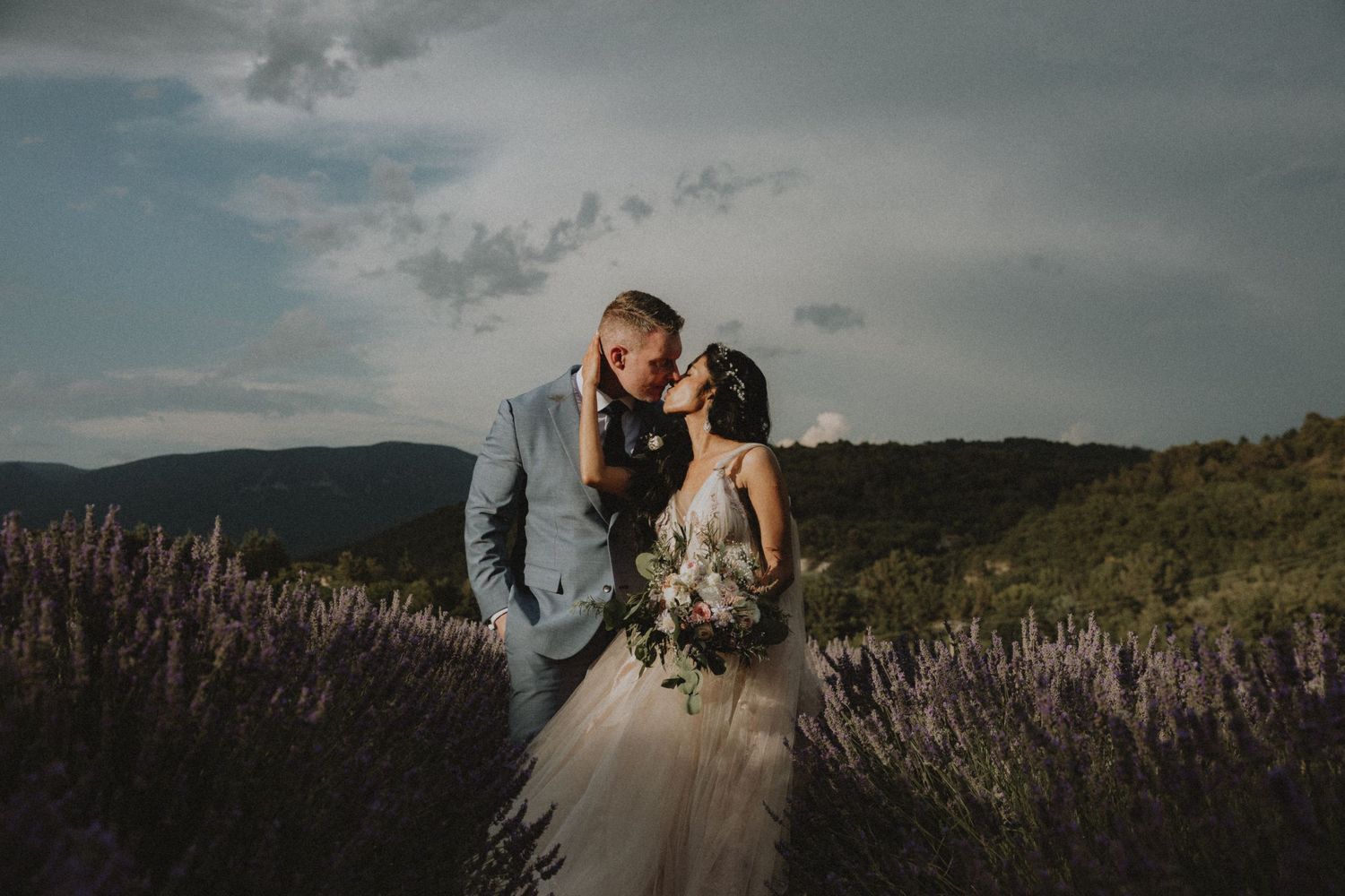 Intimate wedding portrait in the lavender fields of Mas de la Providence, documented on analog film for a timeless aesthetic.