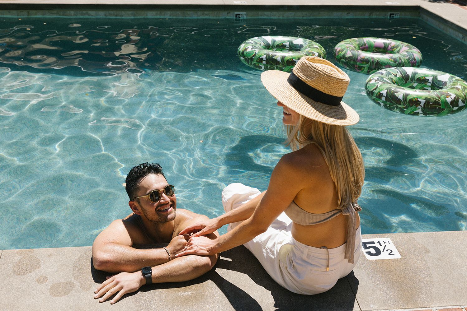 Bride and groom enjoying welcome pool party at Holman Ranch Carmel Valley.