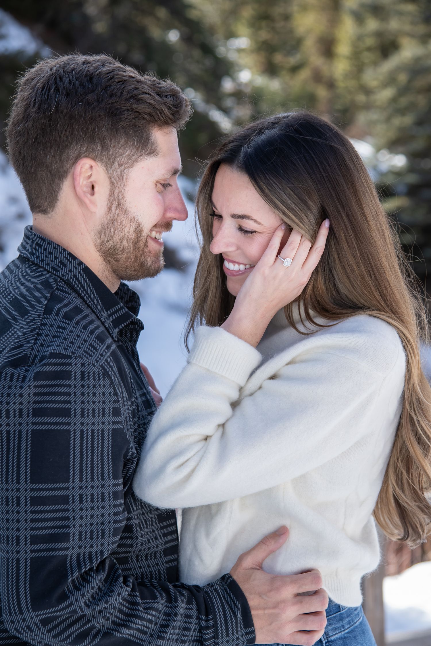Cute candid moment of a couple after a surprise winter proposal in Vail Colorado