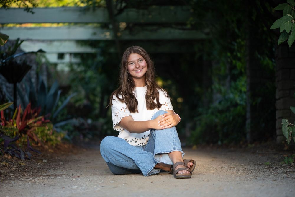 A series of outdoor portrait photographs set against natural backdrops and garden settings during a photo session.