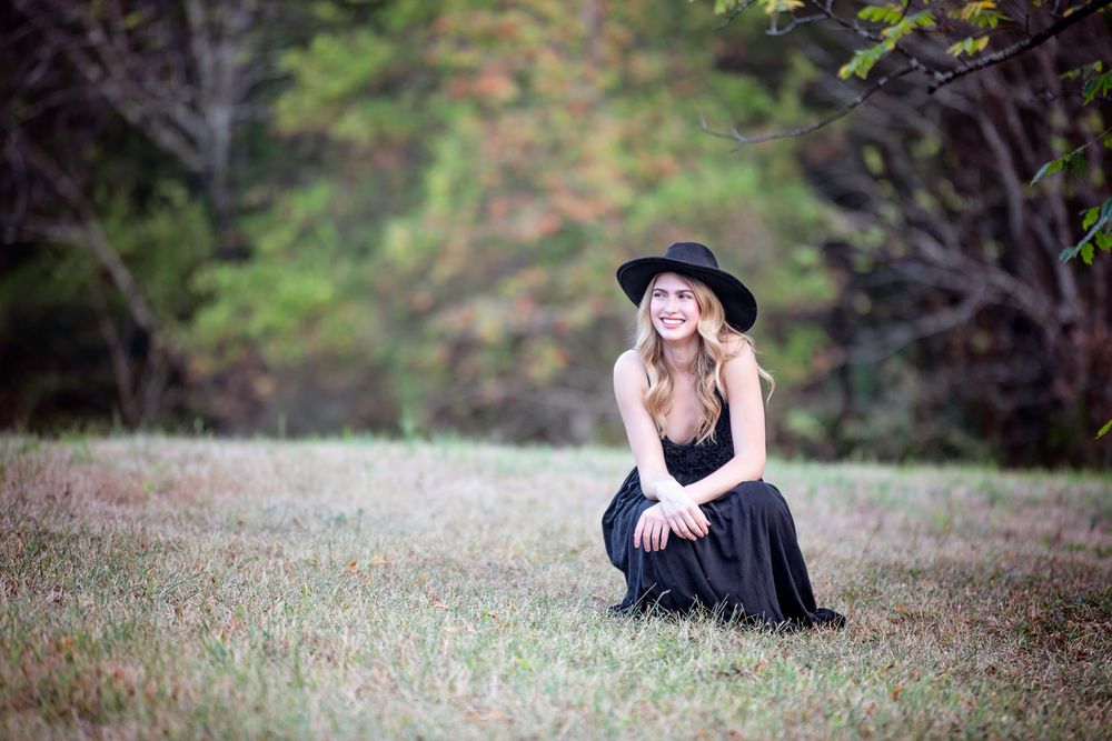 Artistic series of seven romantic outdoor engagement photos taken in a natural rustic setting at dusk.