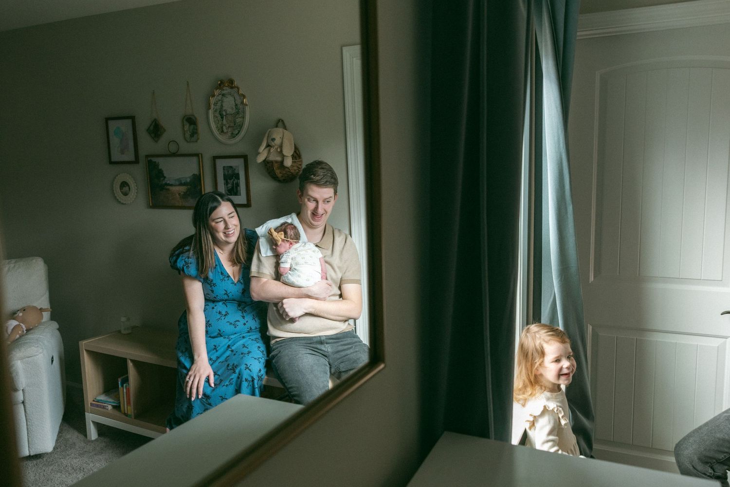 A series of intimate lifestyle photos show a family maternity session in a softly lit bedroom with green curtains.