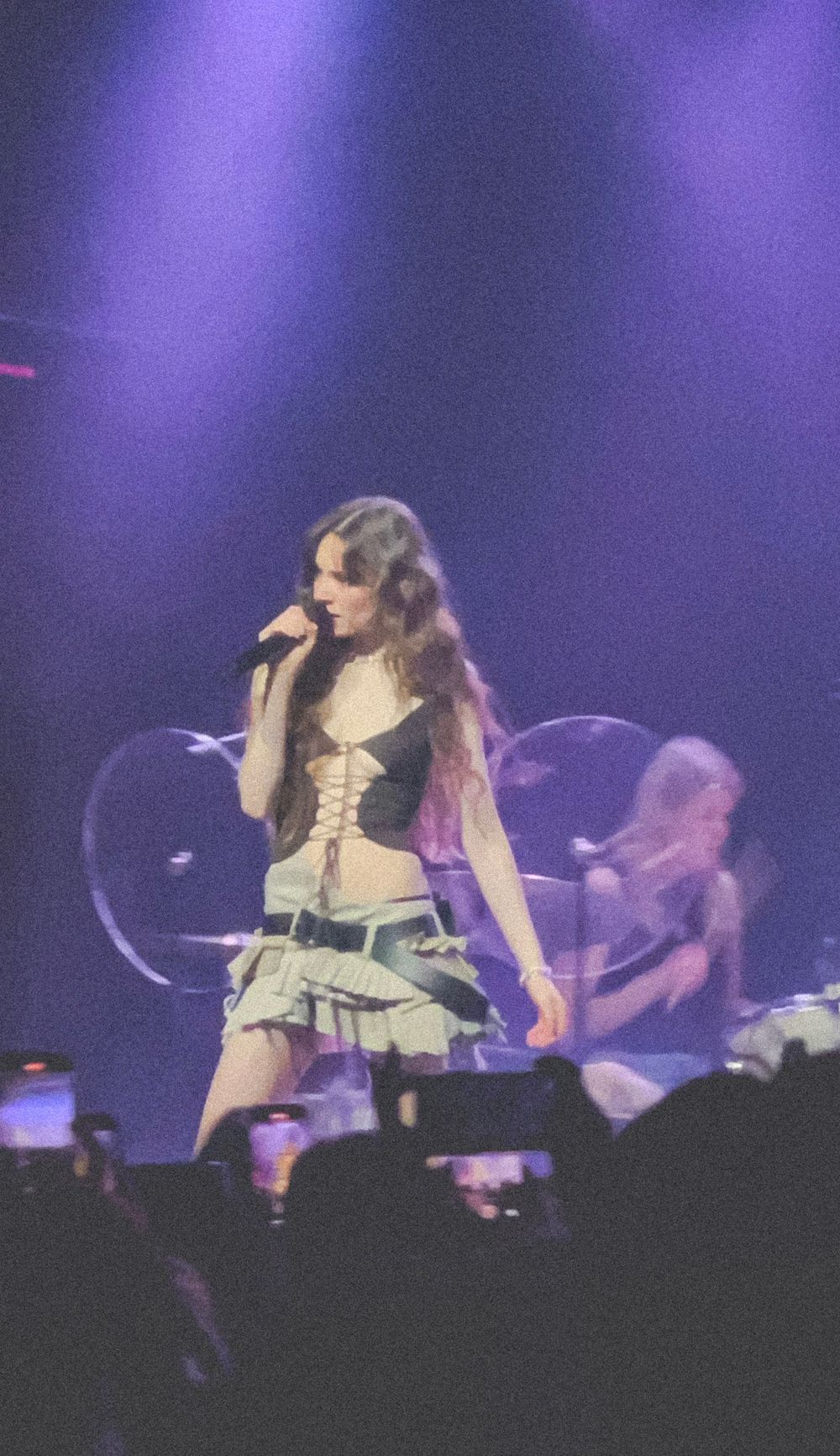 A woman singing on stage