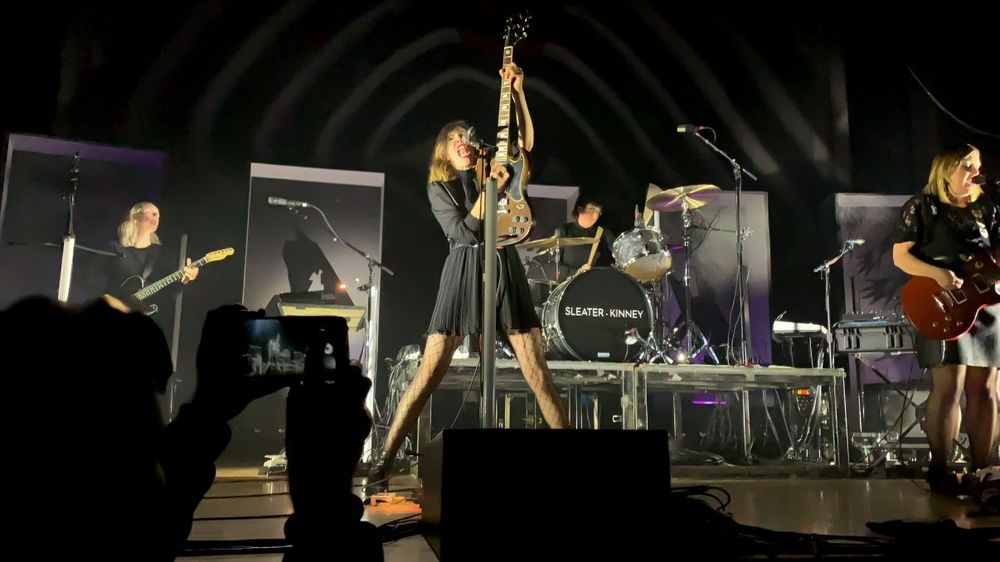 A woman singing on stage