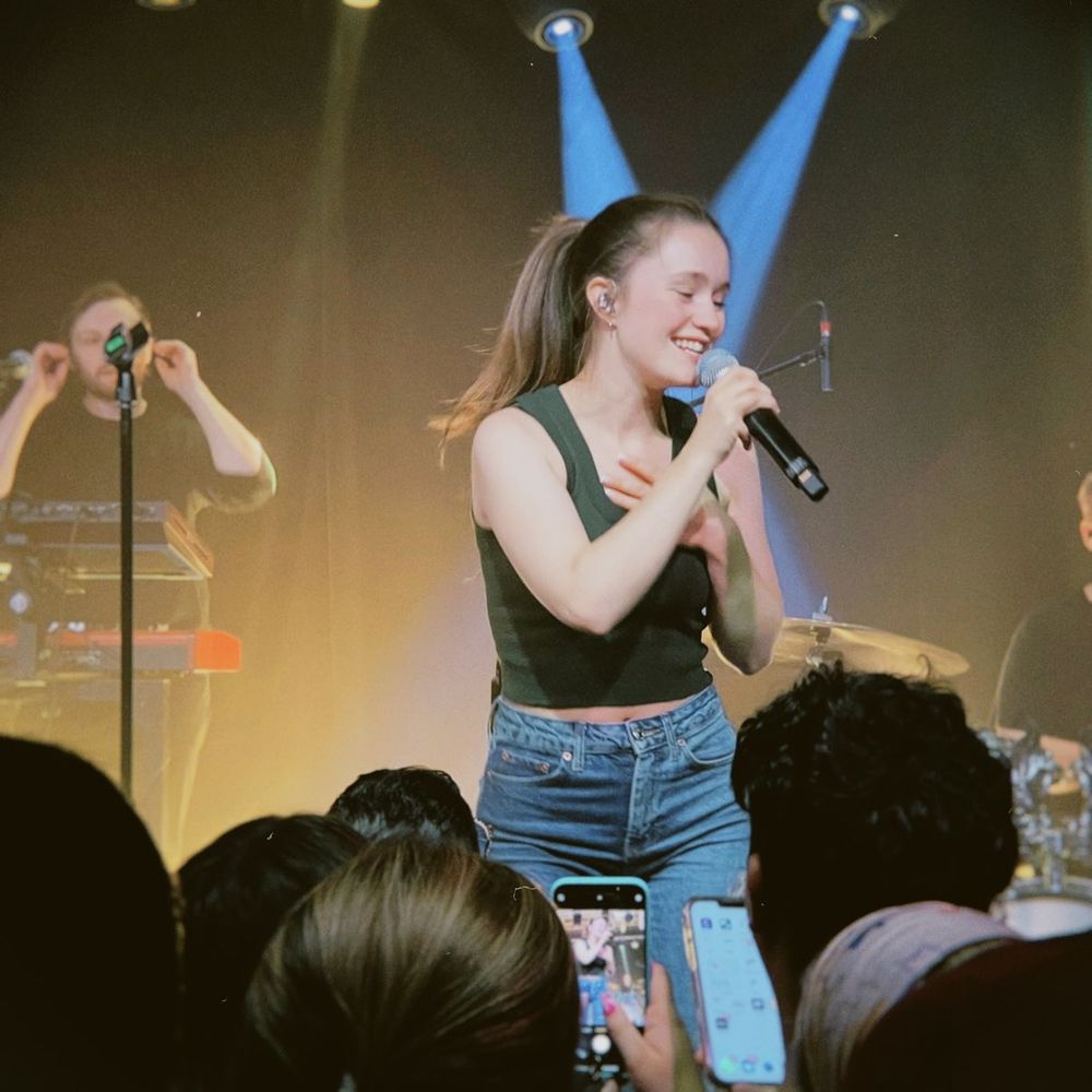 A woman singing on stage