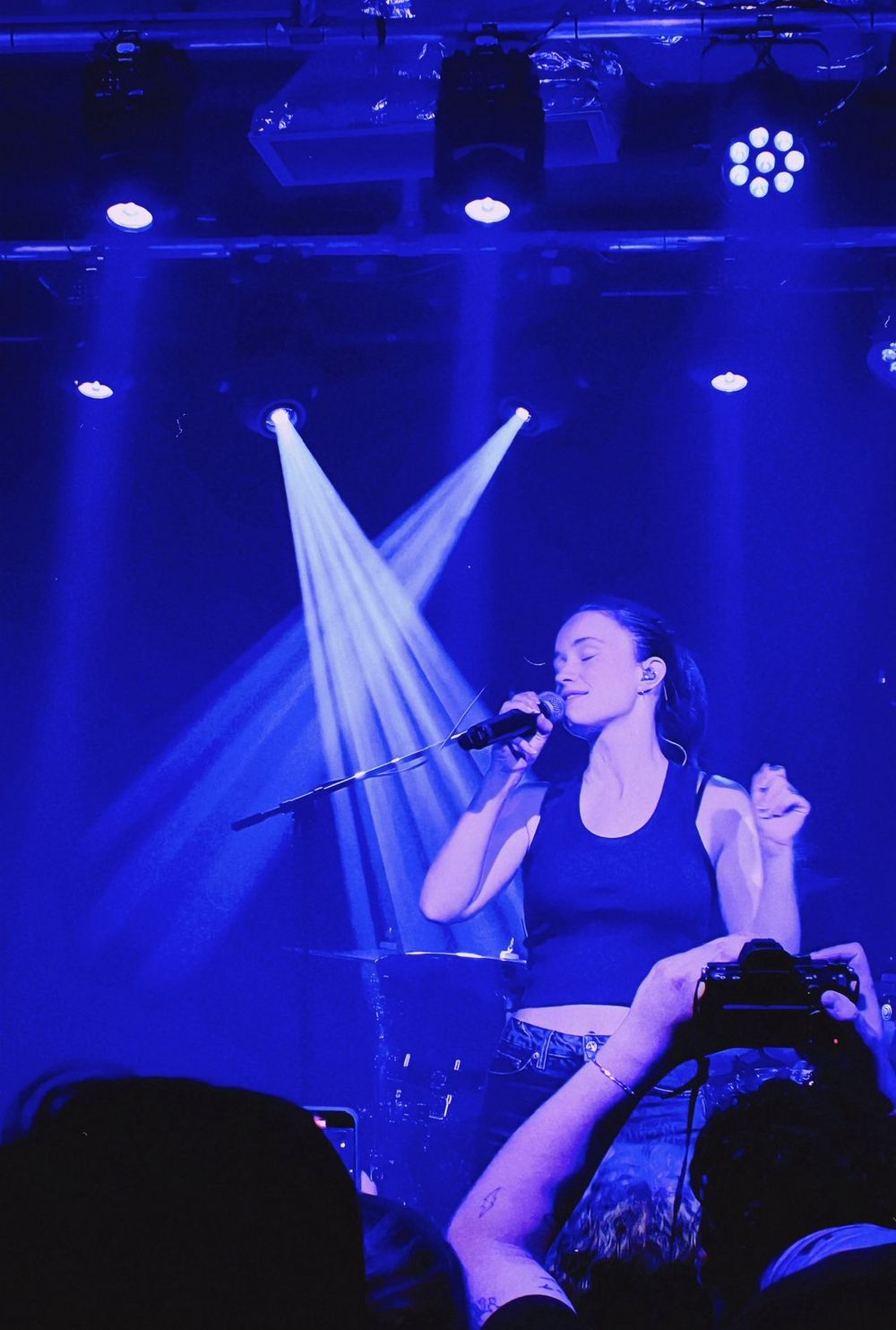 A woman singing on stage