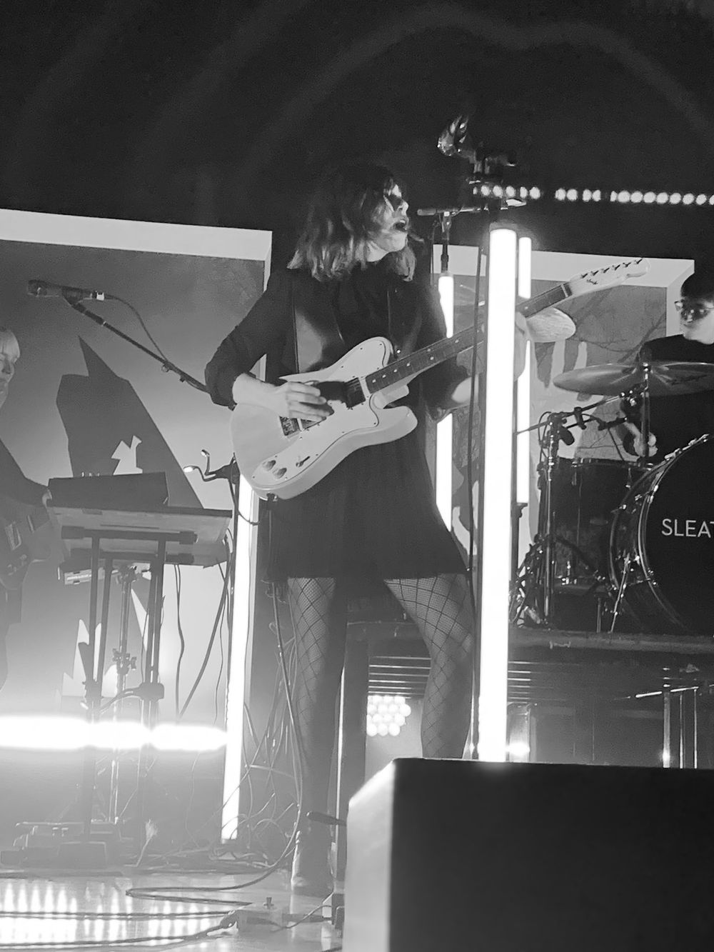 A woman singing on stage