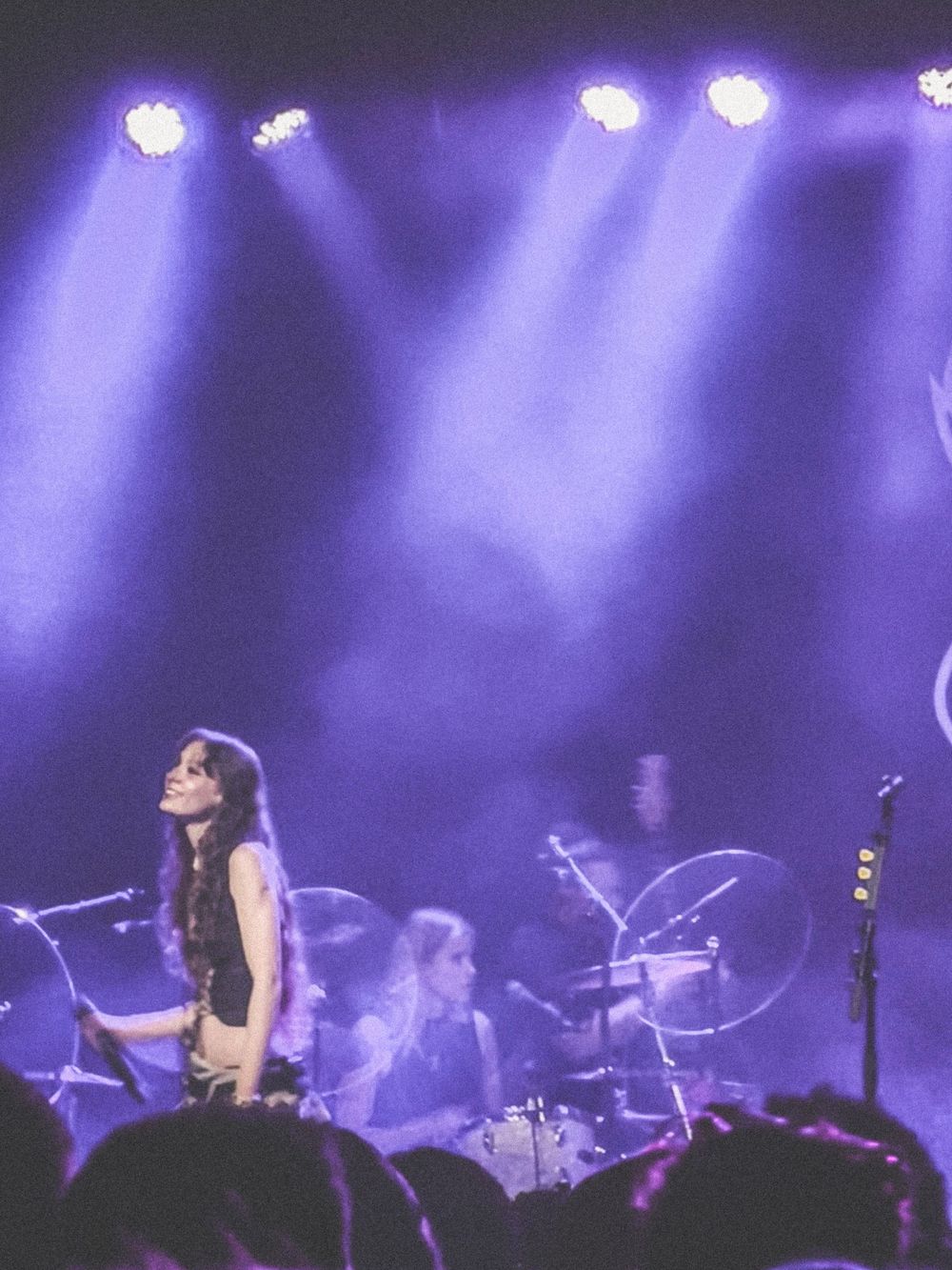 A woman singing on stage