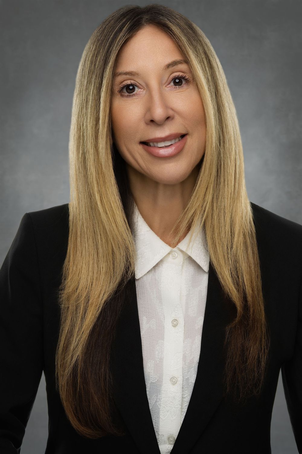 Professional headshot series showing a blonde woman in a white blouse and black blazer against a dark background.