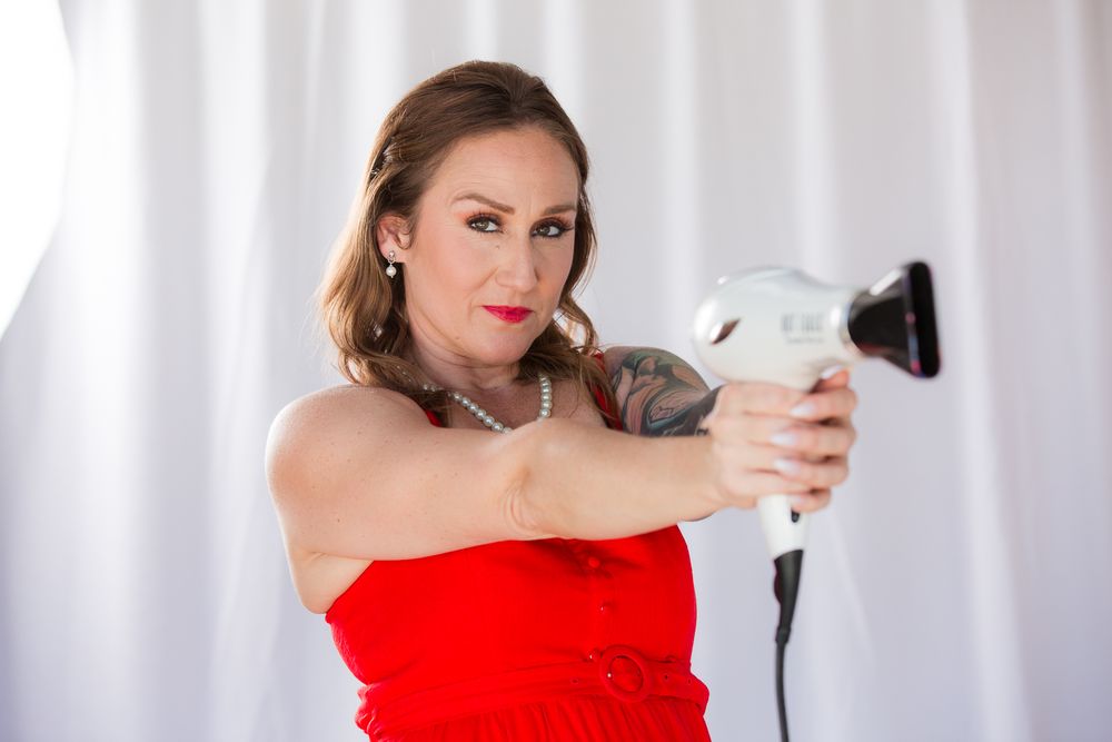 Professional styling poses featuring red dress and pearl necklace in studio setting.