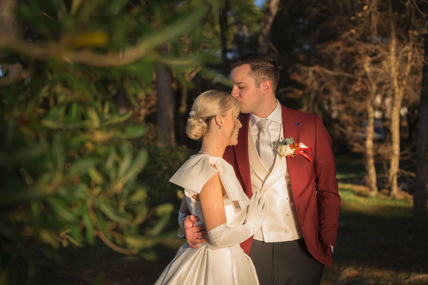 Couple kiss with sun between them
