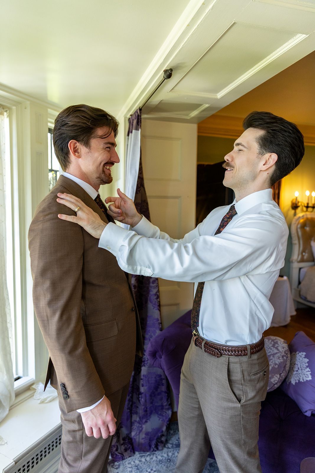 Groom and best man in grooms suite at the thornewood castle wedding venue