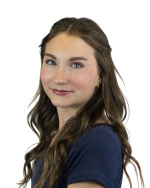 A person in a navy blue top poses playfully in three different positions against a white background.