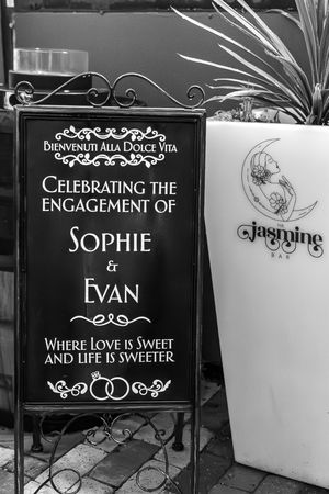 Elegant black and white wedding signs with ornate designs displaying the names Sophie and Evan.