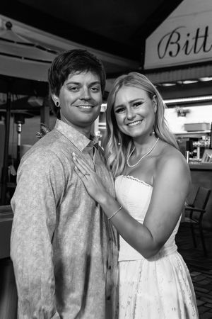 A sequence of black and white wedding photographs showing a joyful couple in elegant attire sharing candid moments together.