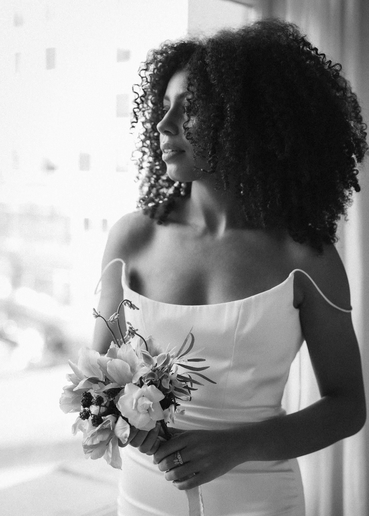 Romantic bridal portraits with white lilies and elegant strapless dress.