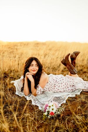 Senior portrait in Tucson desert grasses at sunset, bold colorful senior photography