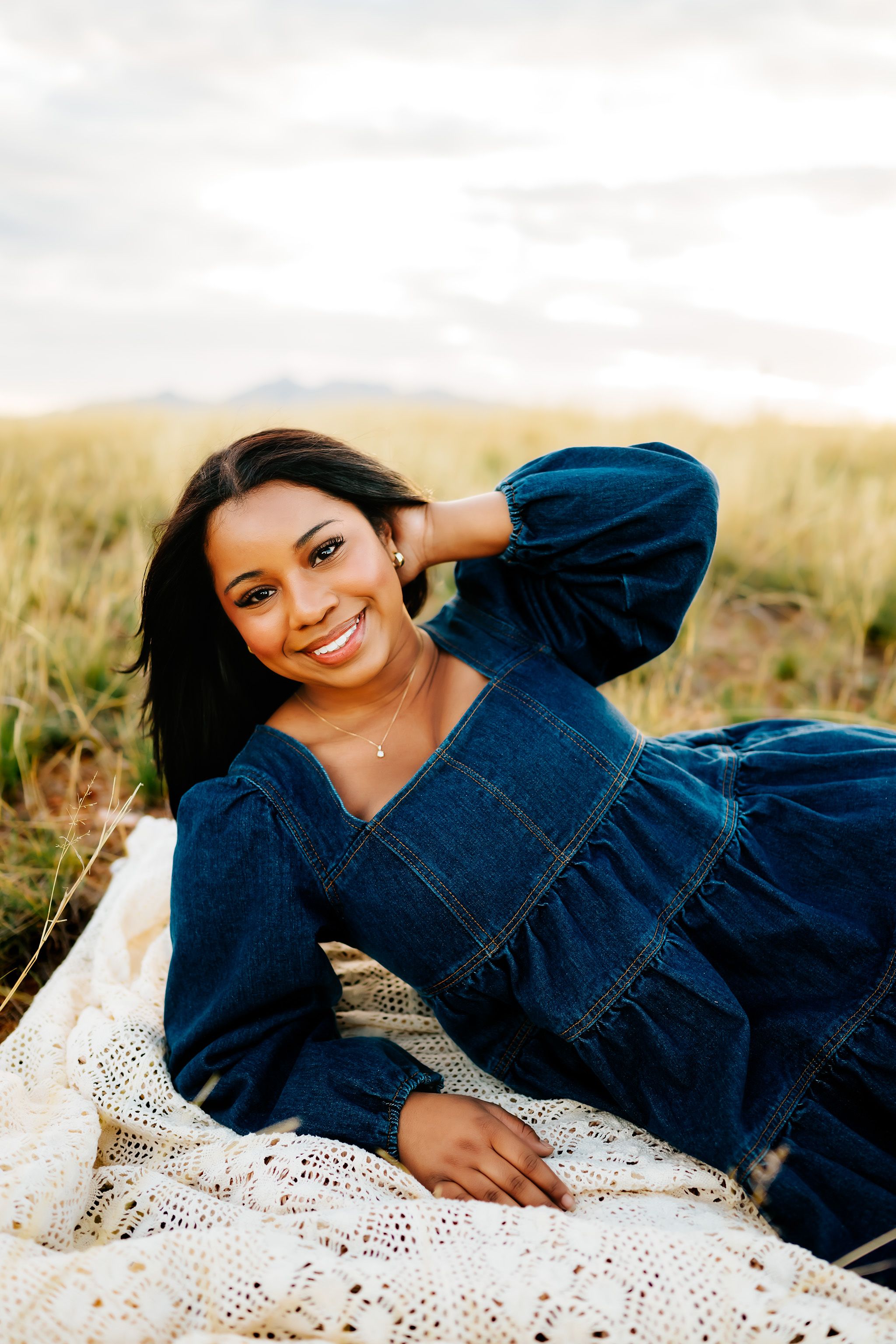 High School senior girl posing in Sonoita Arizona desert during golden hour, outdoor senior photography session