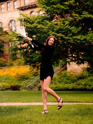 Dynamic motion shots on grass with brick building backdrop in summer setting.