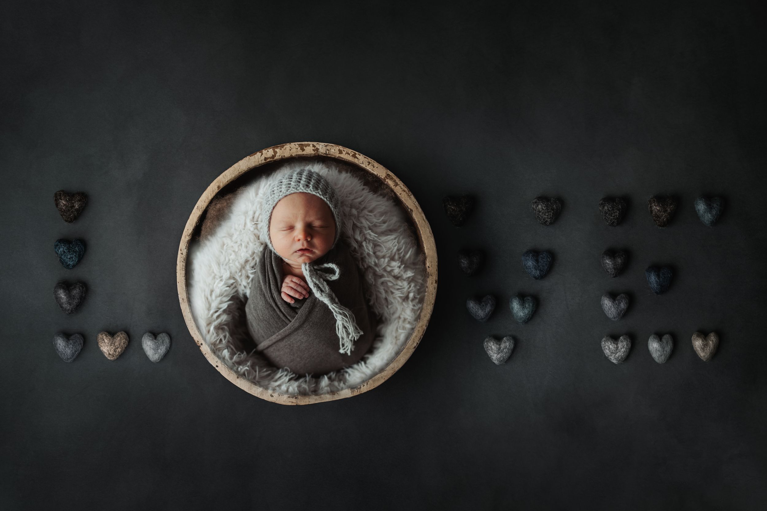 Artistic overhead shots of a sleeping infant in dark moody lighting. Photographer. Hull. East Yorkshire. Photography