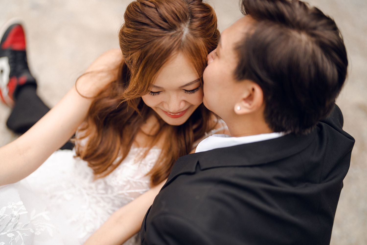 An intimate close-up of a wedding couple sharing a romantic moment.