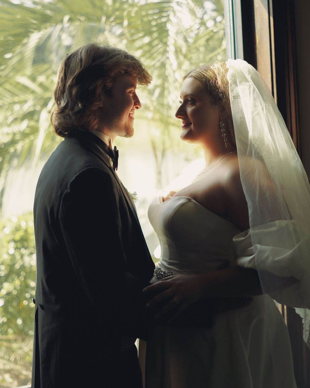 Bride and Groom, captured in a window at a luxury venue in southeast georgia. Capturing their true love for one another.