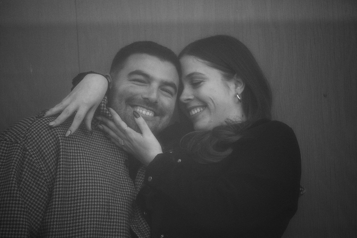 Black and white intimate portraits of a couple sharing romantic moments together.