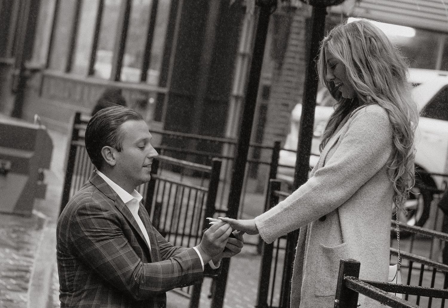 A series of candid black and white photos showing a couple interacting on a city street.