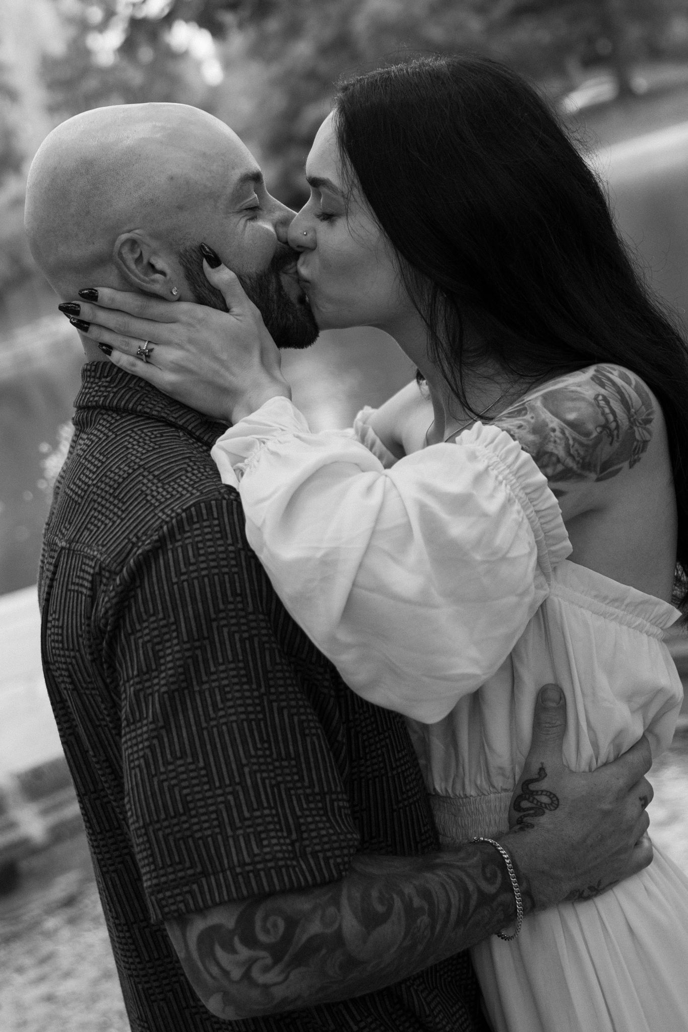 Black and white series showing tender moments between a couple in vintage-inspired clothing.