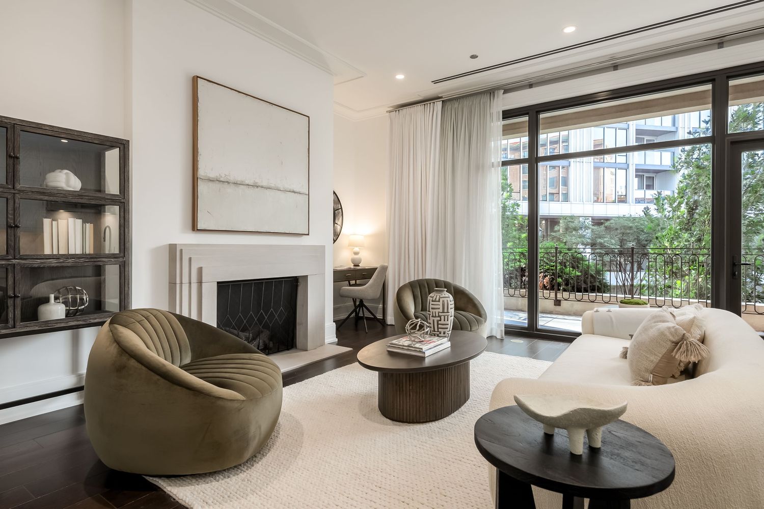 Warm and modern living room in Chicago condo with floor to ceiling windows and contemporary furnishings.