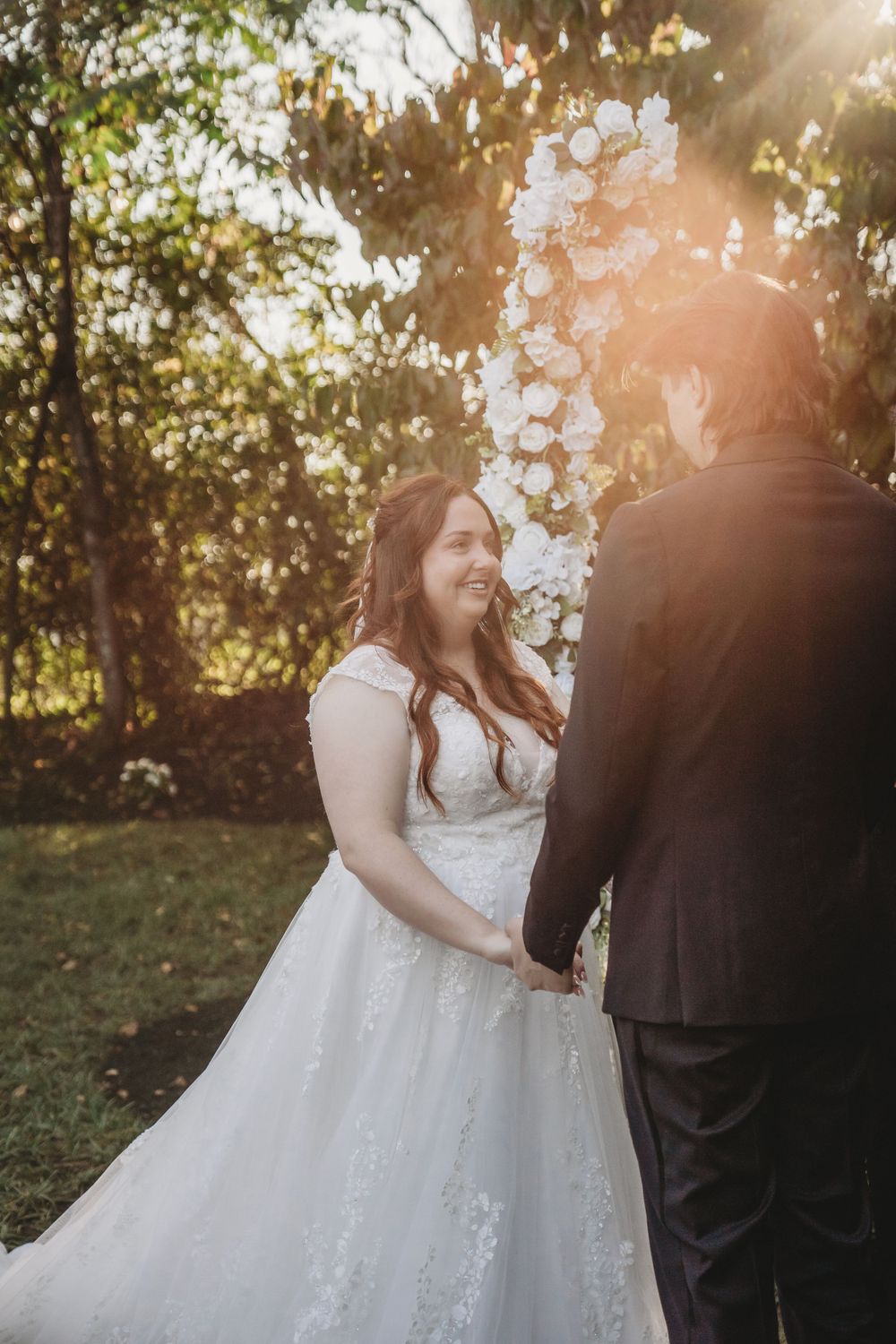 Golden hour wedding portraits captured in a dreamy outdoor setting.