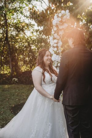 Golden hour wedding portraits captured in a dreamy outdoor setting.