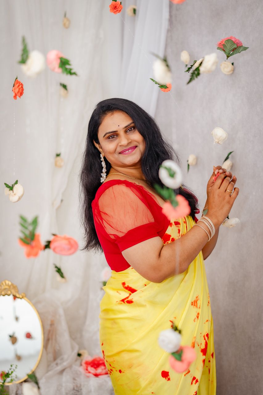 Mini session of gorgeous woman celebrating herself amidst floral backdrop, radiating beauty during mothers day
