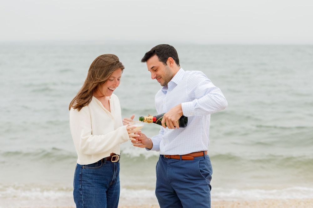 A beachside proposal sequence showing a couple celebrating their engagement.