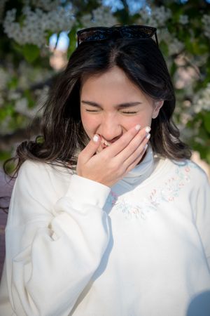 Portrait of a woman laughing in Old Town Sacramento by Sacramento photographer, Ashley Nicole Baeza.