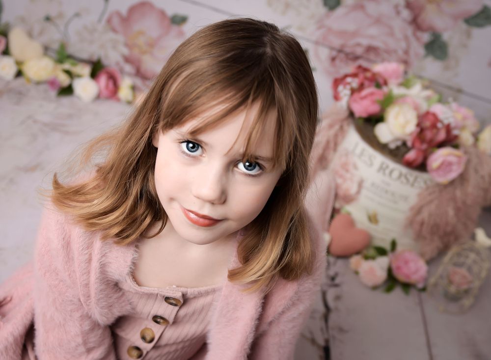 Image of child in a flower scene for a mothers day session.