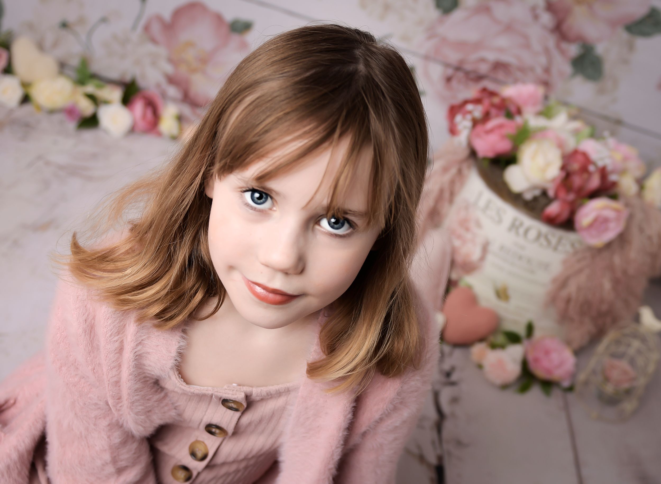 Image of child in a flower scene for a mothers day session.