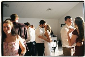 A series of candid dance party photos showing people dancing and moving in a bright indoor space.