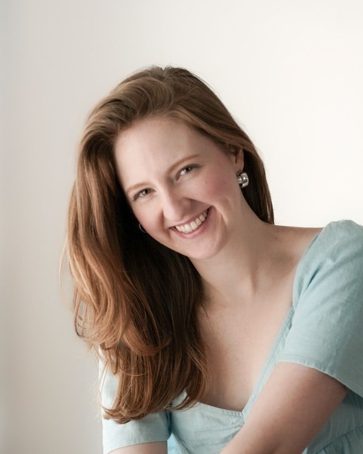 A professional portrait of someone in a light blue top smiling warmly against a neutral background. Cuyahoga Falls, Ohio