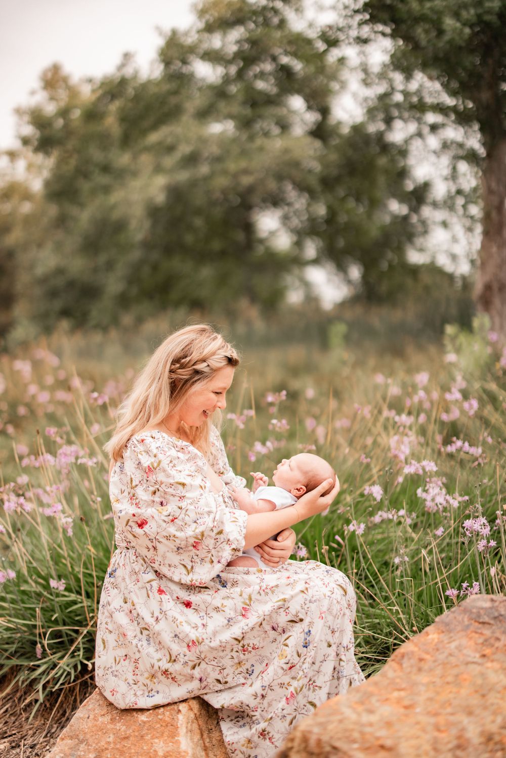 A tender moment captured in a wildflower meadow with blooming purple flowers.