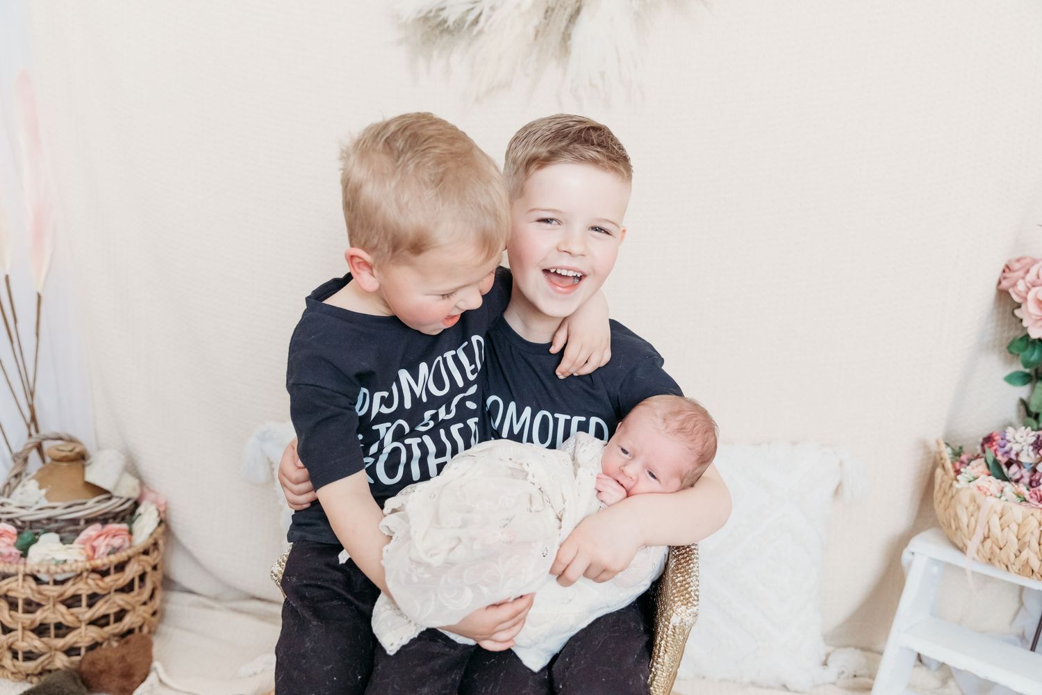 Three children in black shirts posing together for family photo. Photographer. Hull. East Yorkshire. Photography