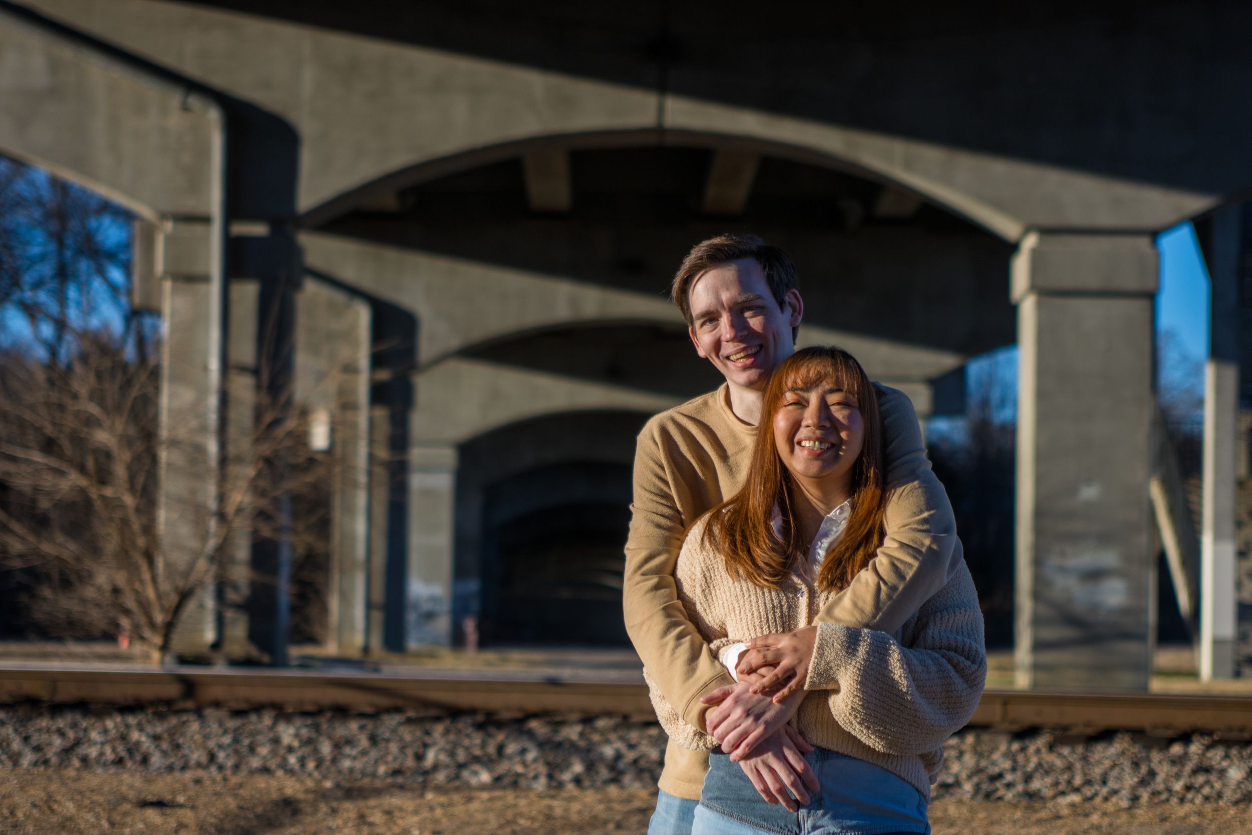 Laughing couples portrait taken under a bridge in Old Town Petersburg, portrait taken by Chris Suits Photography