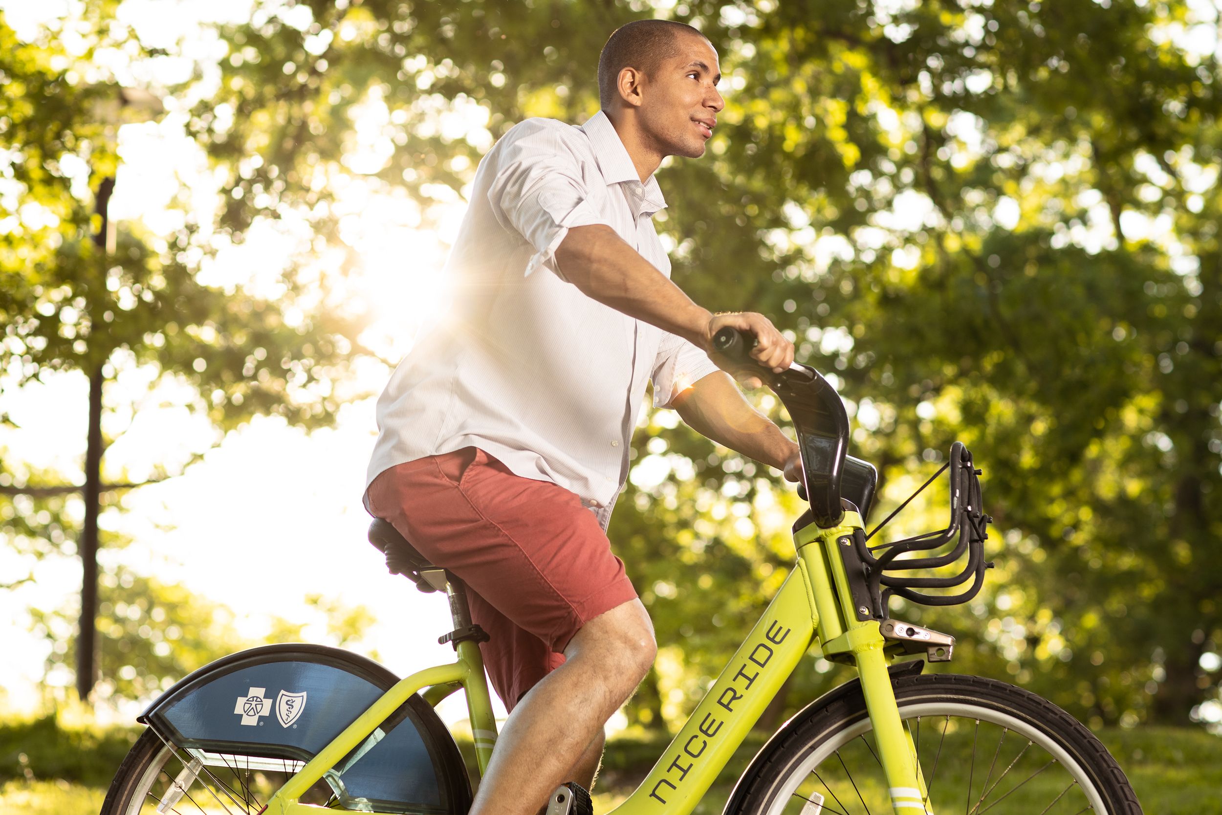 Men ridding a rented bike Nice rides in Minneapolis mn Minneapolis photographer lifestyle image