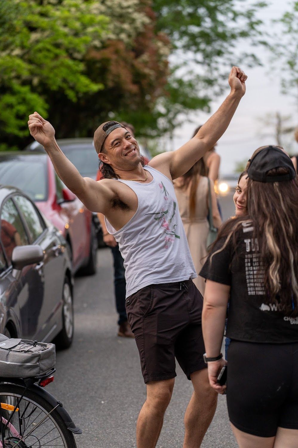 Person dancing in the street during a front porch music event in Charlottesville.