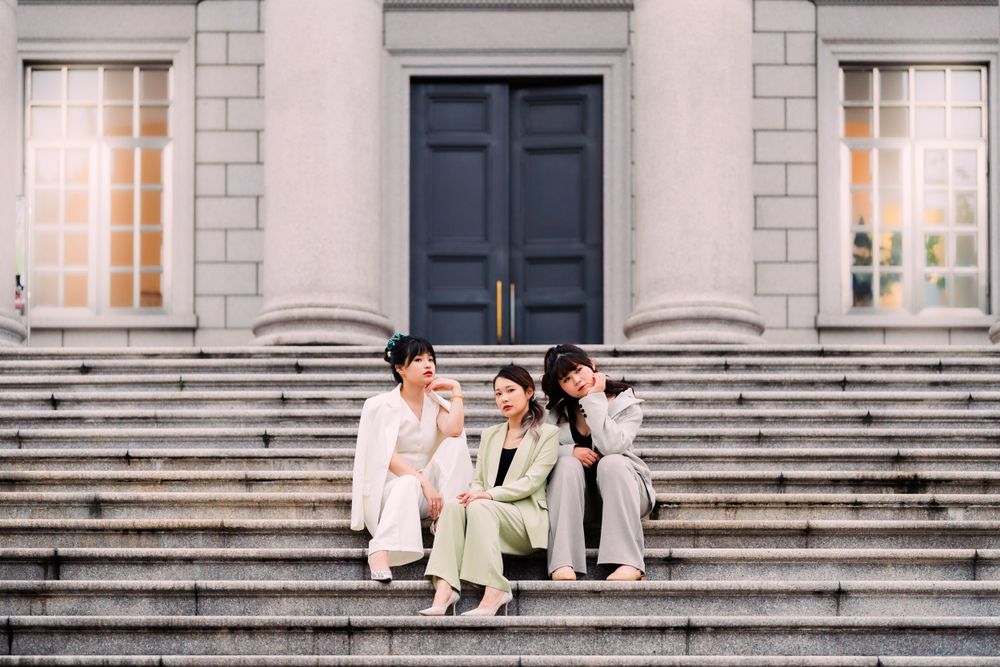 three friends on the stairs at Tatung University in Taipei city