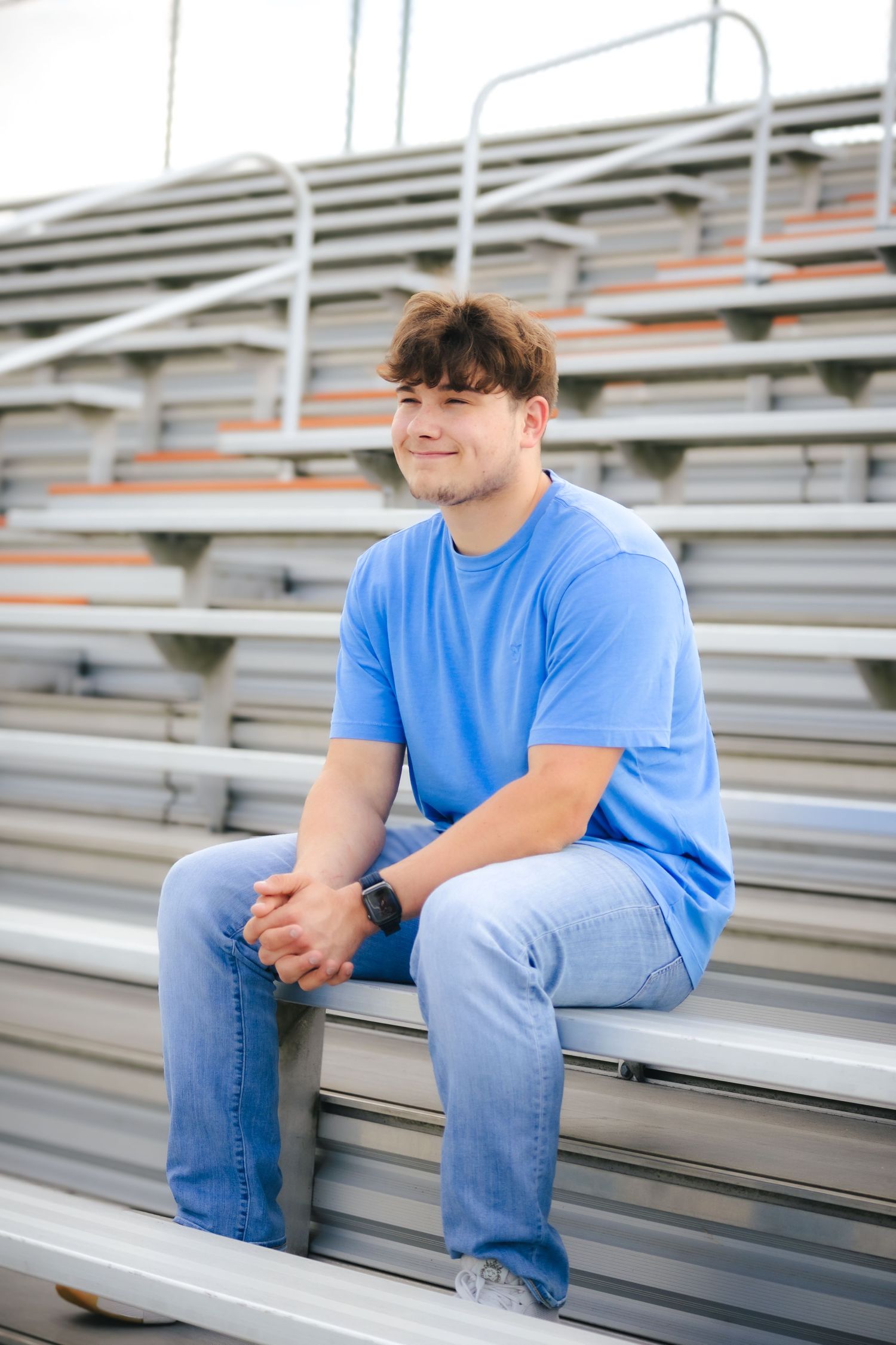 Outdoor spring senior photos at stadium in Hillsboro, Illinois