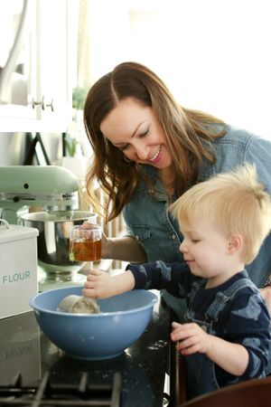 Cooking scene in kitchen with mixing bowl and ingredients for baking.