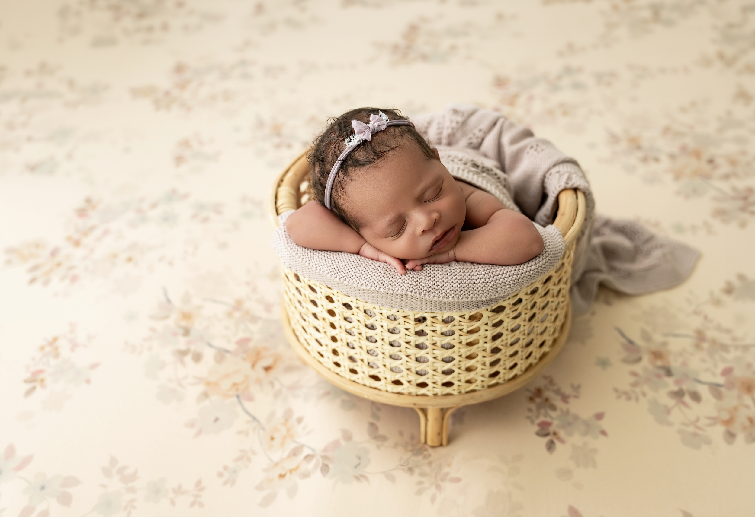 Mauve newborn session centering around flowers during a studio newborn session in Lexington, KY.