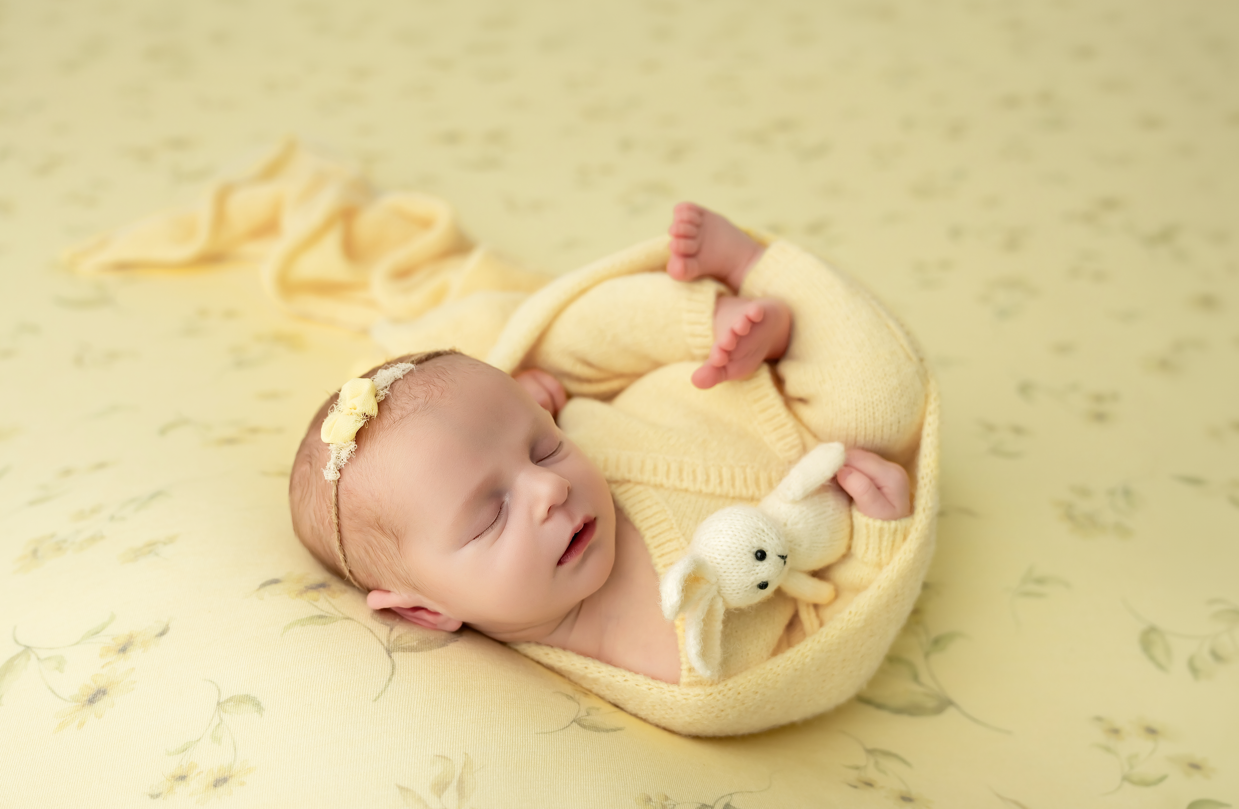 Newborn baby in a floral setup at her newborn session in studio, Lexington, KY.